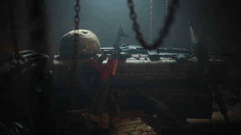 Elevation tracking shot of a weapons arsenal stockpile (pistol, kalashnikov Stock Footage 337745640