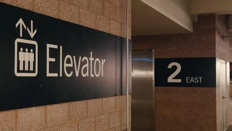 Elevator and Floor Signs Inside Public Parking Lot Stock Footage 346201101