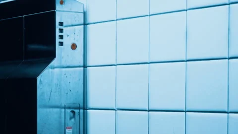 Elevator and tiled wall in a modern building during daytime Stock Footage 343936333
