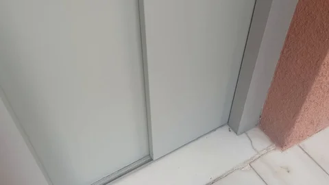 The elevator arrives and opens the door. The view from the outside. Stock Footage 117999699
