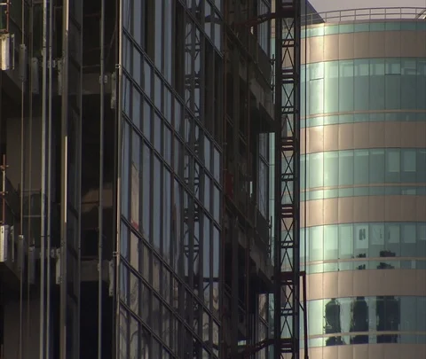 Elevator ascending on outside of high-rise construction Stock Footage 86744928