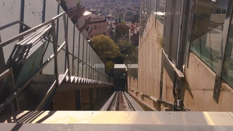 An elevator ascends pulled by cables to save a drop of several feet. Stock Footage 105801941