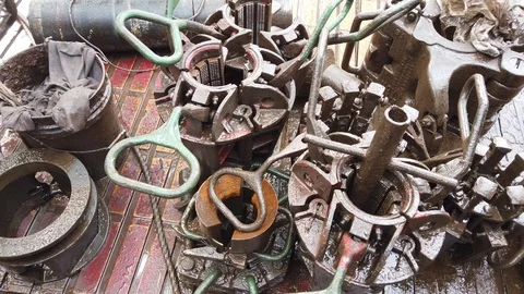 Elevator, bushing and slips on a rotary table of a drilling rig Stock Footage 102637874