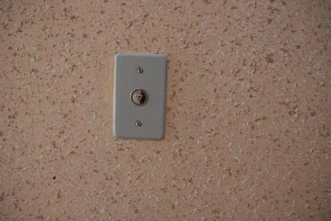 Elevator button close up orange wall 스톡 사진