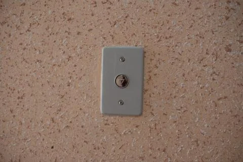 Elevator button close up orange wall Stock Photos