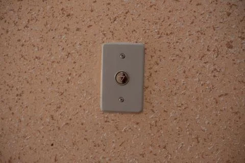 Elevator button close up orange wall Stock Photos