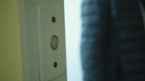 Elevator button, door opens, a man in a black jacket comes out Stock Footage 131741805