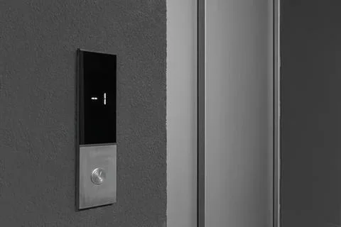 Elevator button panel with digital display on wall Stock Photos