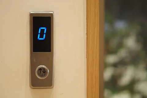 Elevator button showing the current floor number zero Stock Photos