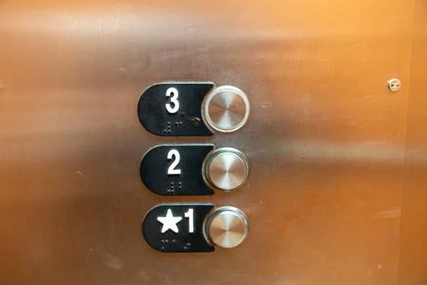 Elevator buttons inside the elevator, for floors 1, 2 and 3 Stock Photos