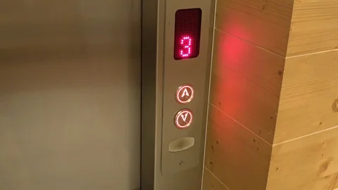 Elevator buttons lighting in a high class hotel, handheld Stock Footage 83216961
