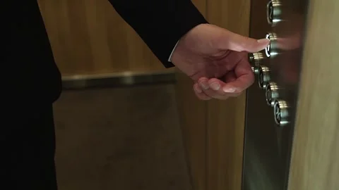 Elevator buttons, a man's hand in an elevator presses the floor selection button Stock Footage 294185808