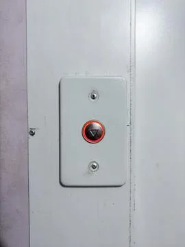 Elevator call button, new button in old house, silver button with red backlight Foto stock