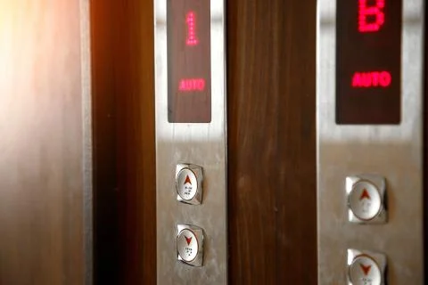 Elevator call buttons. selective focus, shallow depth of field Stock Photos