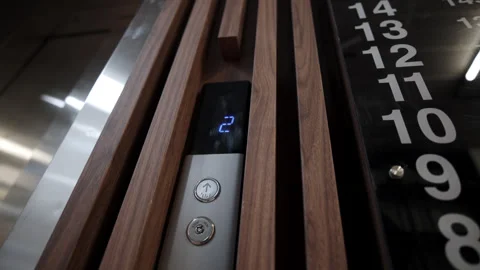 Elevator call panel displays moving cabin indicator 스톡 동영상 330109140