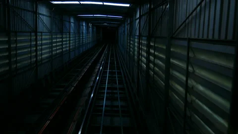 Elevator for carry people or things moving downward into the dark tunnel Stock Footage 238446815