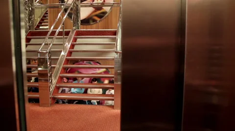 Elevator closing and people at the stairs Stock Footage 32240550