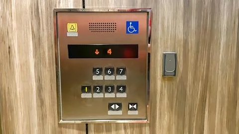 Elevator control panel with Braille buttons and RFID reader in a modern condomin Stock Photos