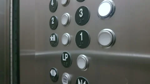 Elevator control panel with glowing third floor button and braille indicators Stock Footage 341954846