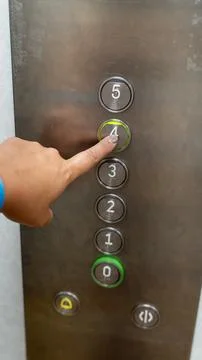 Elevator Control Panel with Hand Pressing Floor Four Button Stock Photos