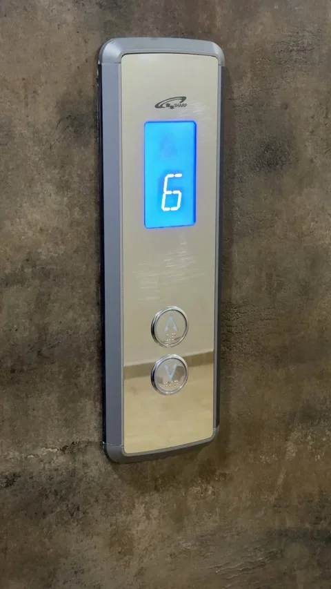 Elevator control panel with number four displayed on blue screen, featuring.. Stock Footage 336272883