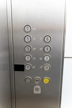 Elevator Control Panel with Numbered Floor Buttons and Alarm Stock Photos