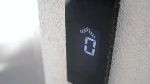 Elevator display shows zero as it approaches the ground floor Stock Footage 345386595