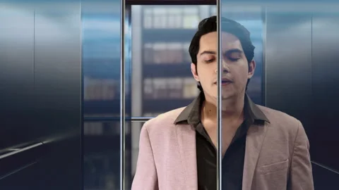 Elevator door closing with a handsome man Stock Footage 197408362