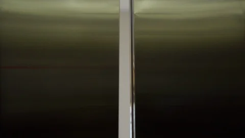Elevator door opens and person inside sees a young woman and she smiles to him Stock Footage 88274175