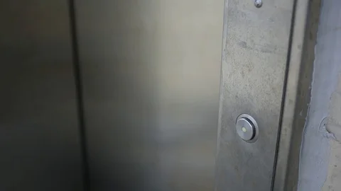 Elevator door opens on rooftop of parking garage - close up Video stock 83367601
