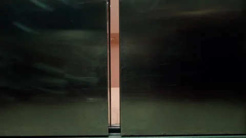 Elevator doors closing and opening onto a staircase hallway Stock Footage 346012177