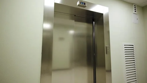 Elevator doors display digital floor indicator showing level 스톡 동영상 332737210