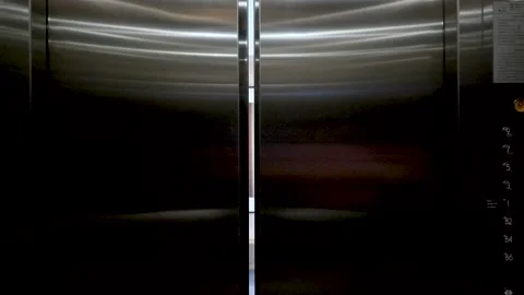 Elevator doors Lobby Interior With Wooden Wall Art, Minimalist Bench, And Stock Footage 320616013