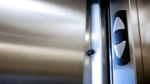 Elevator doors open to bright outside aura on top of building Stock Footage 83368779