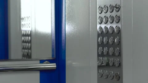 The elevator doors open. Floor number buttons close-up, 4k video Video stock 146999701