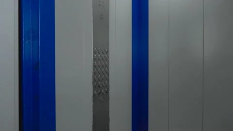 The elevator doors open. The freight elevator opens the beige doors Stock Footage 146999307