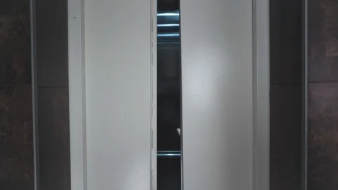 The elevator doors open. Opening the door is an elevator. Stock Footage 111448313