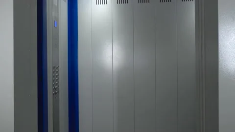 The elevator doors open. Opening the door is an elevator. Stock Footage 146999029