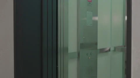 The elevator doors open. Opening the door is an elevator. Metal doors smoothly Stock Footage 293573187