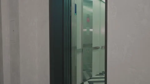 The elevator doors open. Opening the door is an elevator. Metal doors smoothly Stock Footage 293573459
