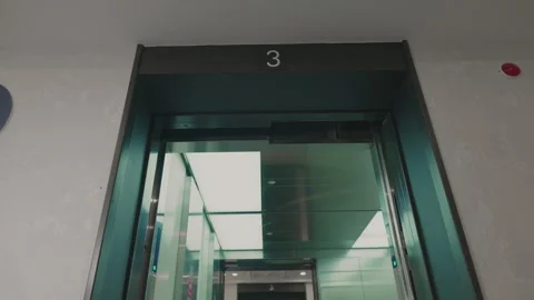 The elevator doors open. Opening the door is an elevator. Metal doors smoothly Stock Footage 293573755