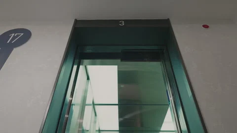 The elevator doors open. Opening the door is an elevator. Metal doors smoothly Stock Footage 293573803