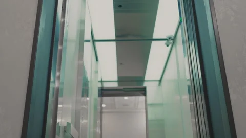 The elevator doors open. Opening the door is an elevator. Metal doors smoothly Stock Footage 293574153