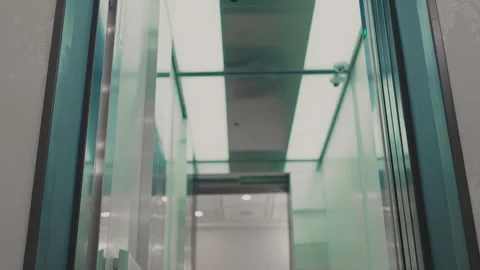 The elevator doors open. Opening the door is an elevator. Metal doors smoothly Stock Footage 293574294