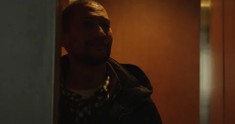 Elevator doors open as professional black man heads into office for work - Stock Footage 237454495