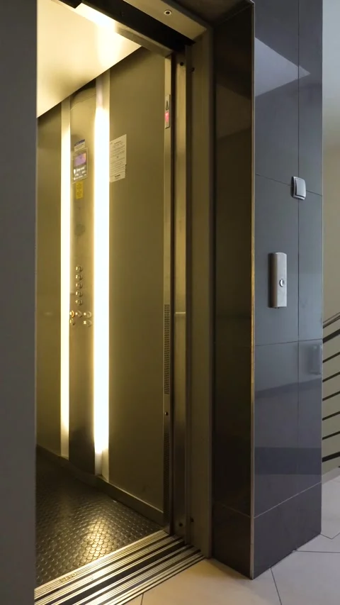 Elevator doors opening and closing in a modern buildin Stock Footage 345589293