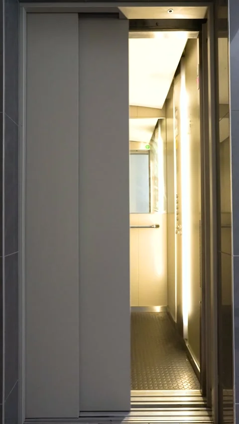 Elevator doors opening and closing in a modern building Stock Footage 345589308