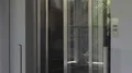 Elevator doors opening, man and female exiting on top floor of luxury hotel HD Footage
