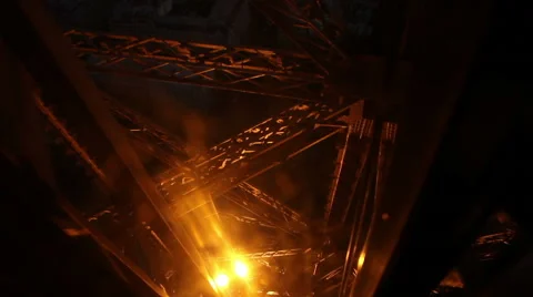 Elevator down Eiffel Tower in Paris as light display sparkles Stock Footage 43902227