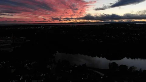 Elevator drone shot to red clouds evening sun down Vídeos de archivo 98744042